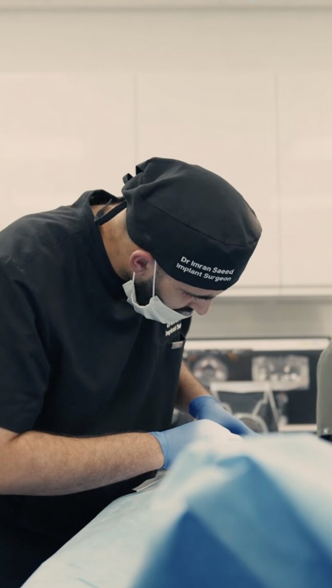Dr Imran Saeed providing chairside dental treatment at Ark Dentistry